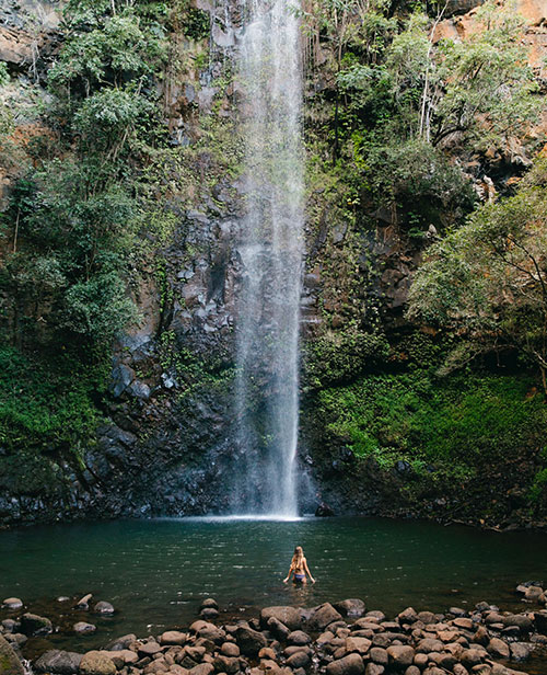 Swimming at Secret Falls in Kauai, Hawaii